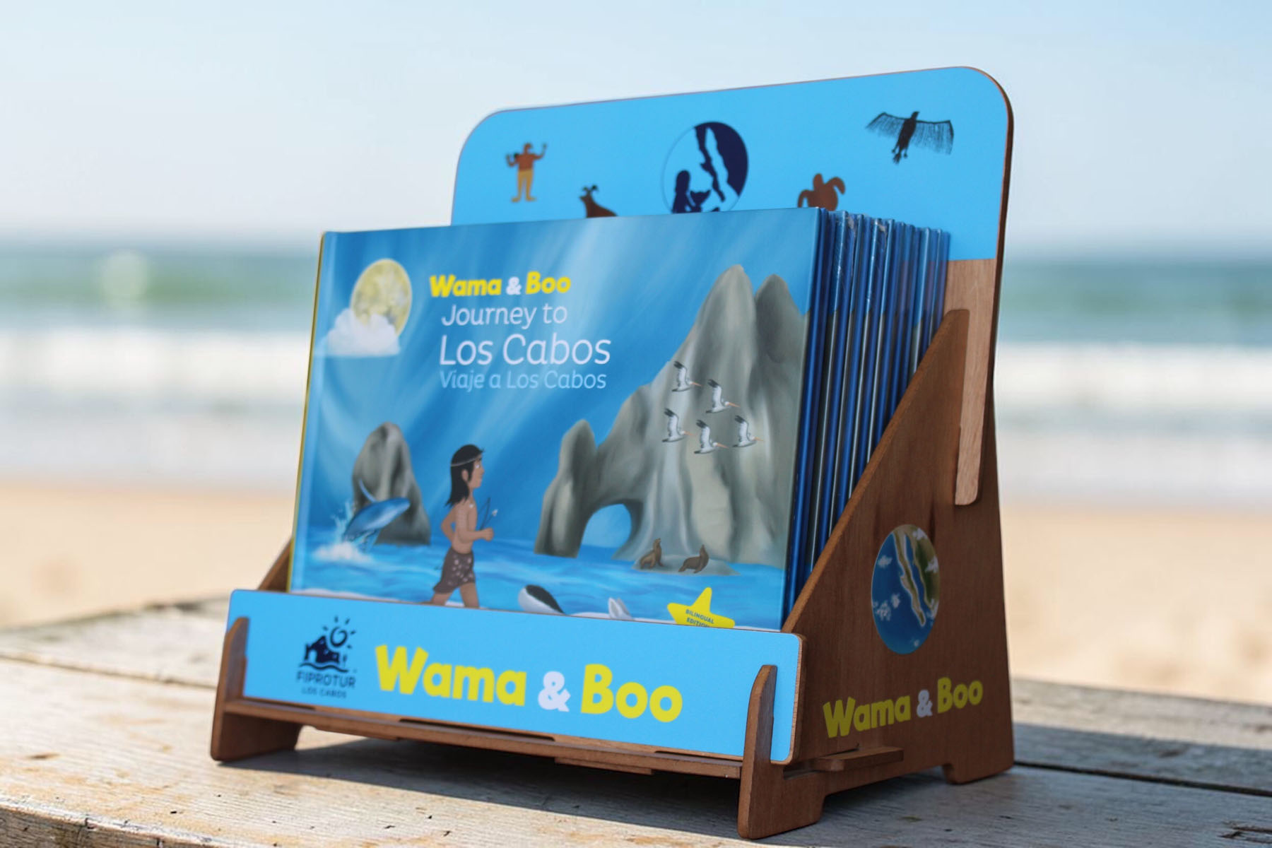 Wama & Boo hardcover book displayed on a custom wooden stand